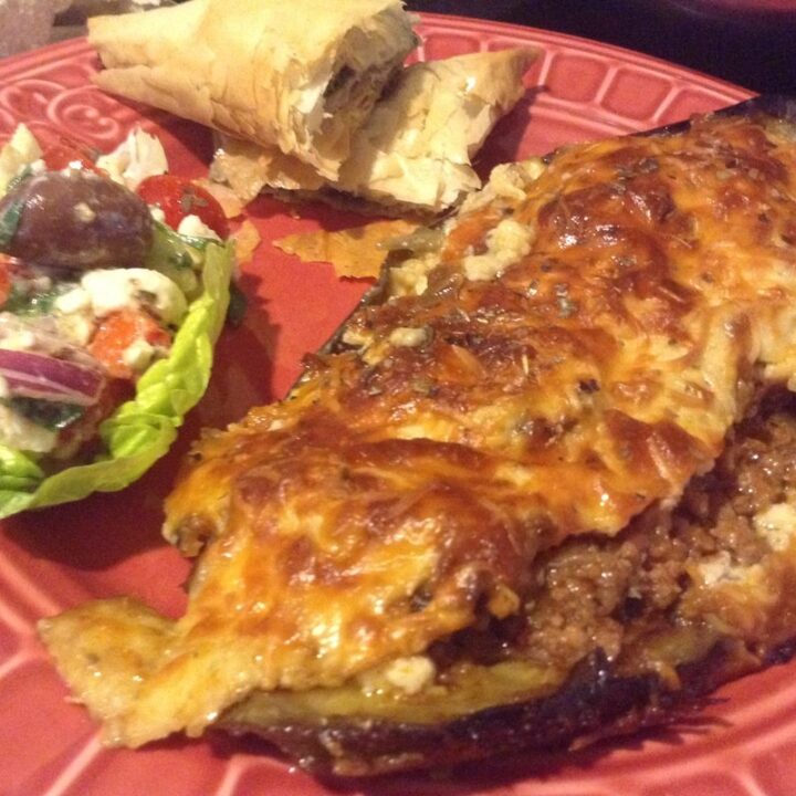 MELITZANES PAPOUTSAKIA: EGGPLANT STUFFED WITH GROUND MEAT SAUCE AND BECHAMEL