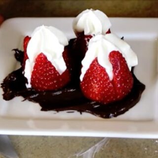 STRAWBERRIES FILLED WITH WHIPPED CREAM OVER BELGIAN CHOCOLATE