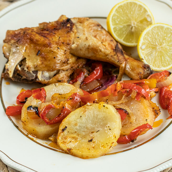 Greek Spatchcocked Chicken with Potatoes & Peppers